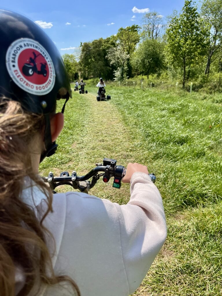 Driving an electric scooter at Baboon Adventures in The Cotswolds